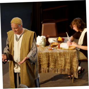 Duffy as THe Apostle Paul, in front of Asher Fickett as Tychicus